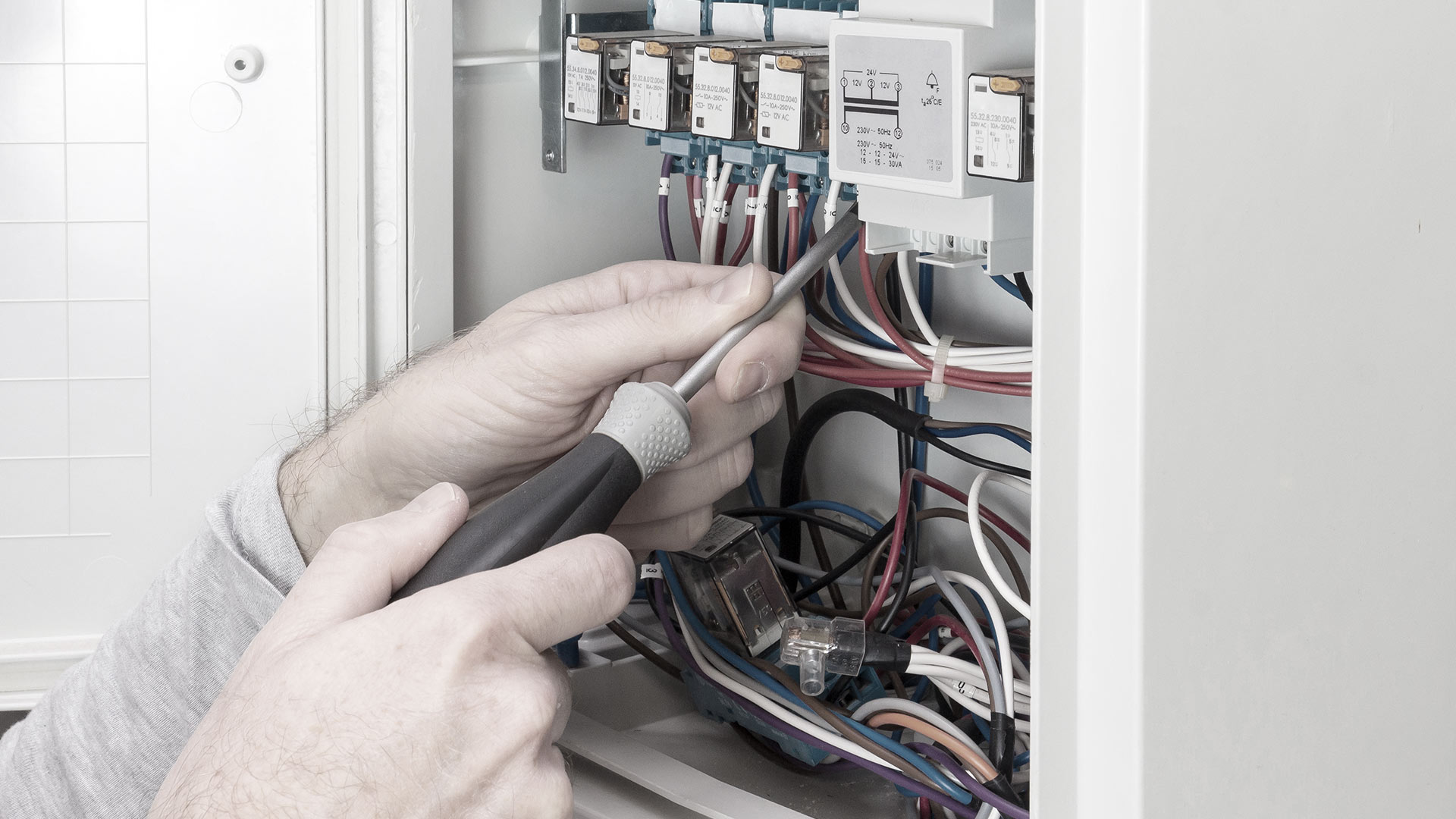 electrician performing an electrical panel upgrade marceline mo